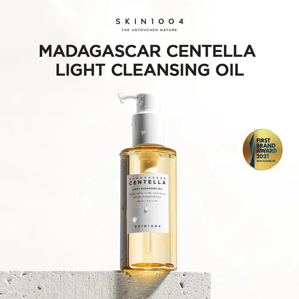 SKIN1004 Madagascar Centella Light Cleansing Oil in a 200ml bottle, featuring clear liquid and skincare branding on the label.