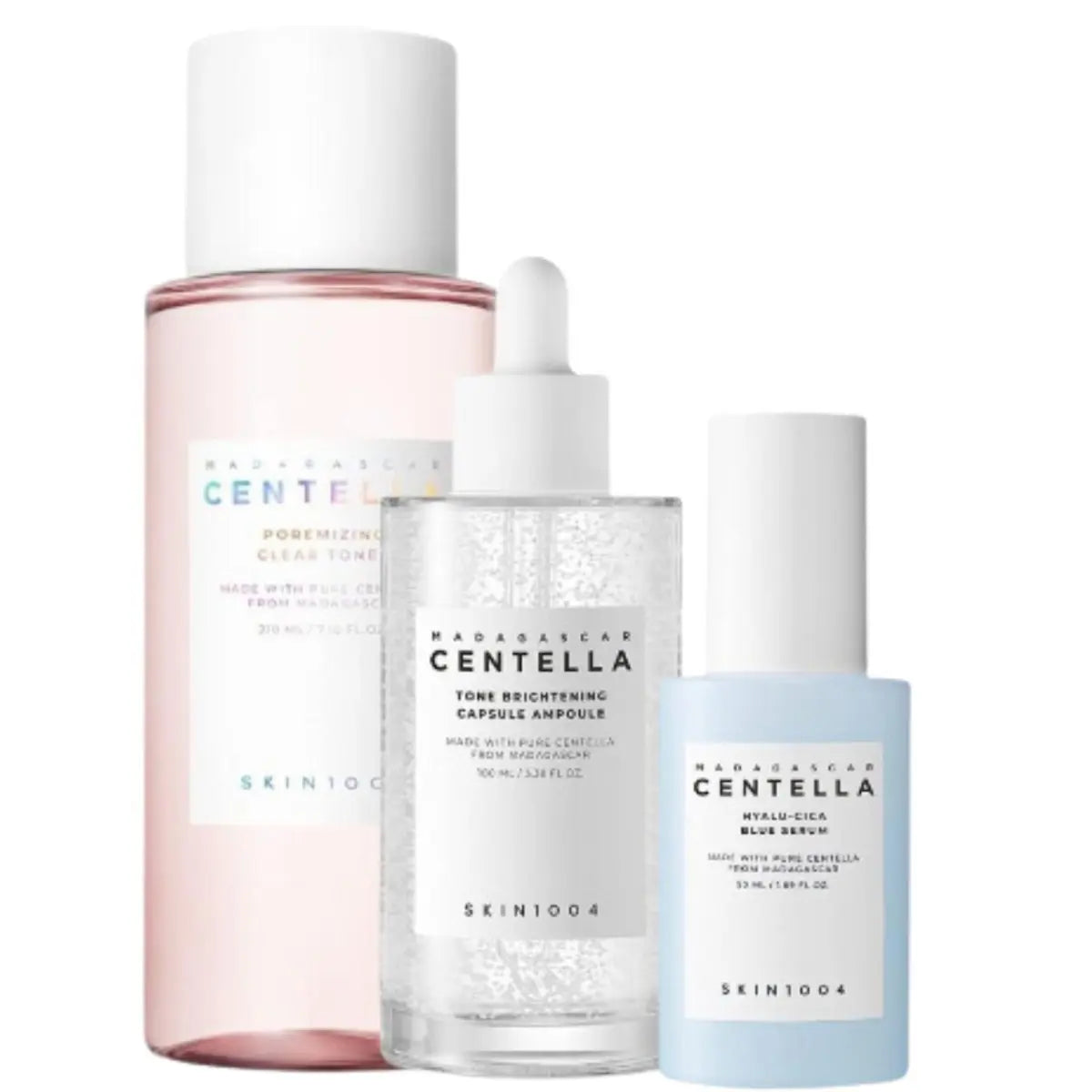 Skin1004 toner, ampoule, and serum set displayed in bottles and containers, showcasing a skincare routine kit with natural packaging.