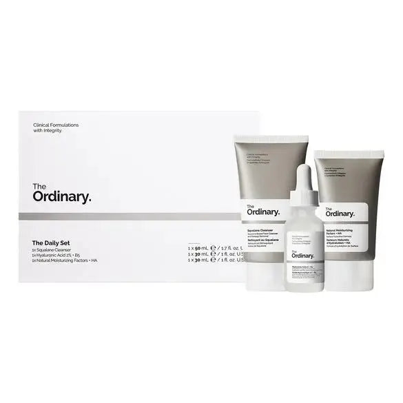 Set of skincare products from THE ORDINARY The Daily Set, featuring bottles and jars of various skincare solutions.